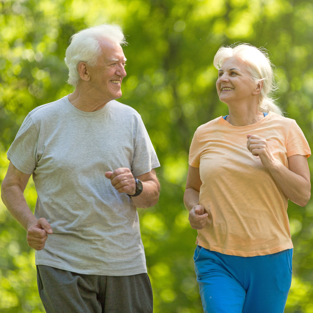 Retiree couple taking an outdoor jog together