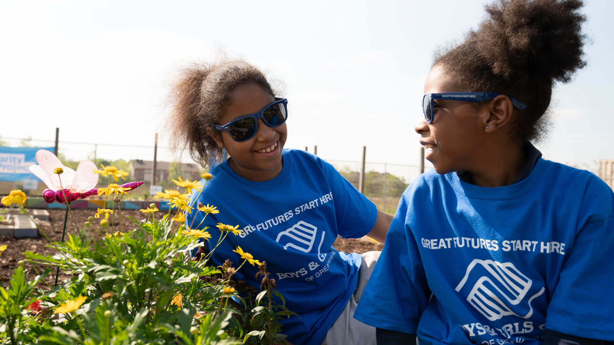 Boys and Girls club participants in a community garden.