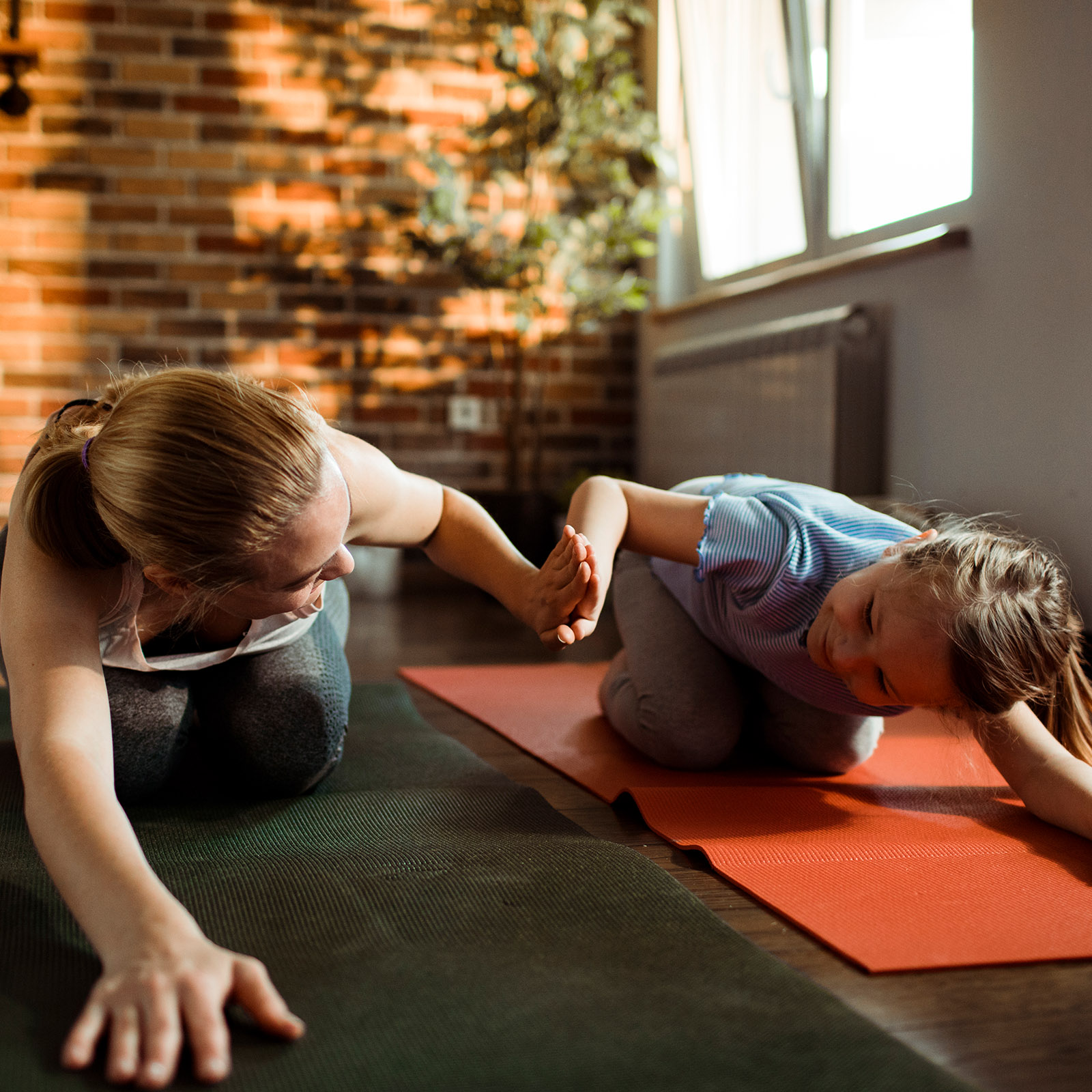 Mom does yoga with daughter