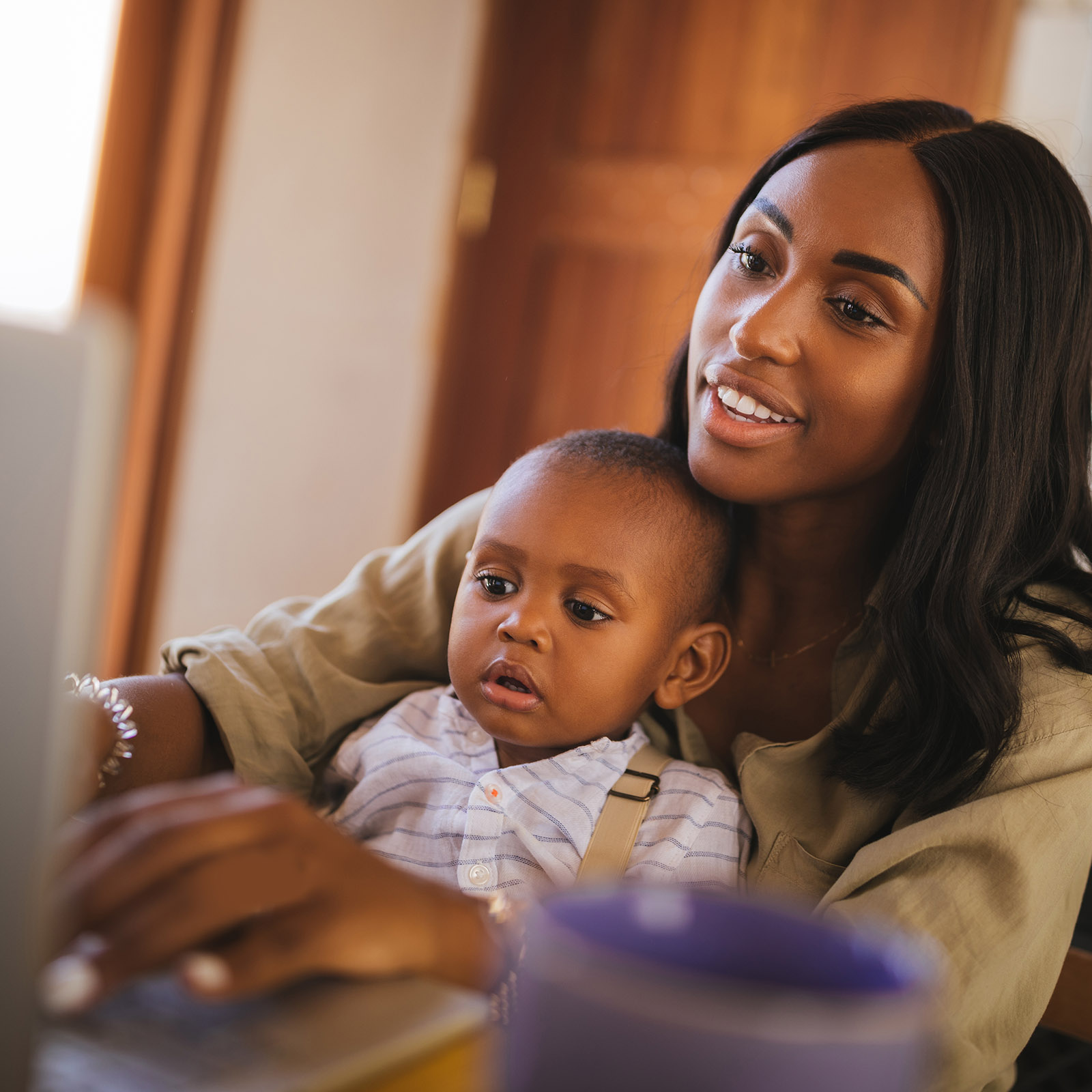 Mother and young son access Medicaid information online