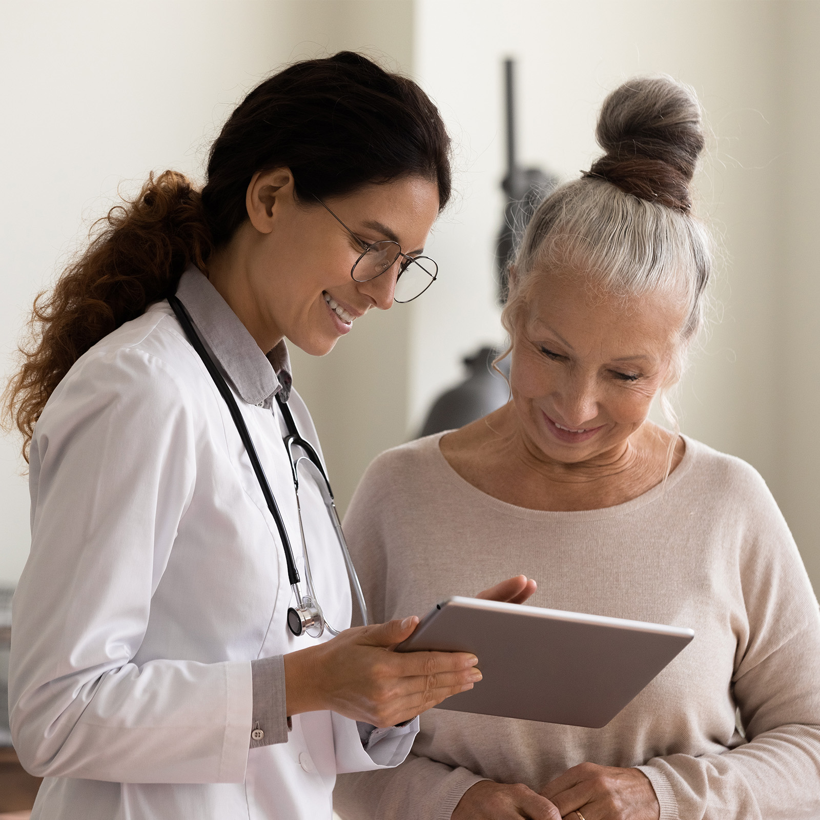 healthcare professional sharing results with patient on tablet