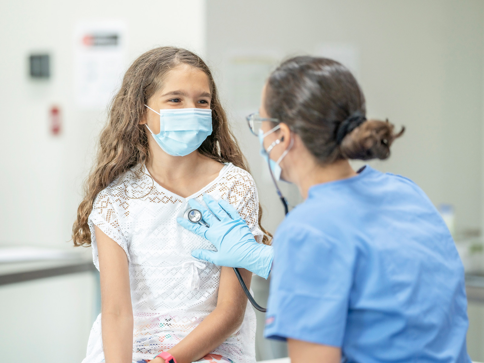 Medicaid healthcare provider with child wearing face masks