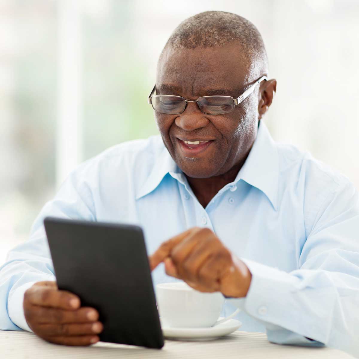 Gentleman reviewing plan information on his tablet